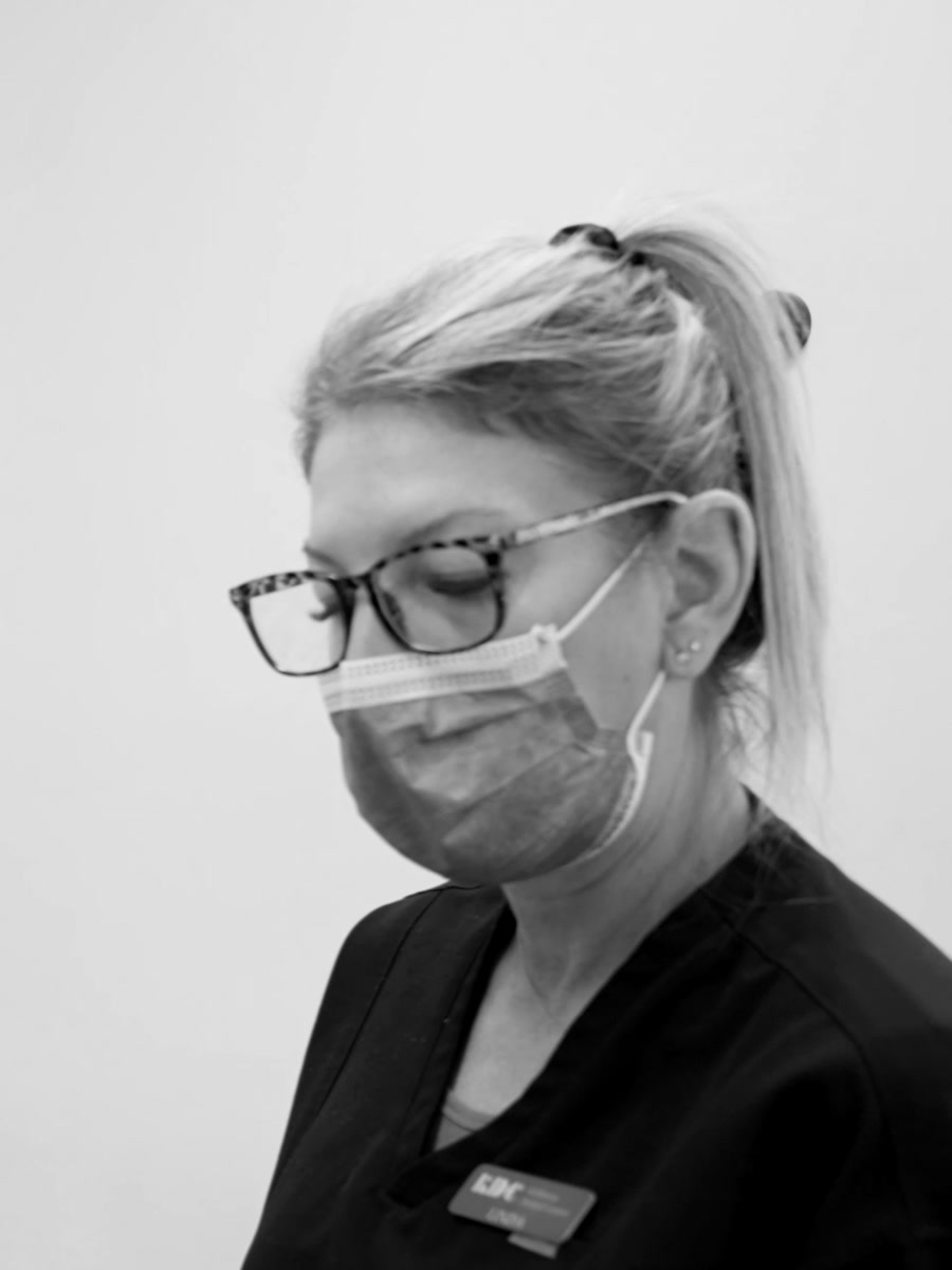 A hygienist at work in an operatory at Kelowna Dental Centre.