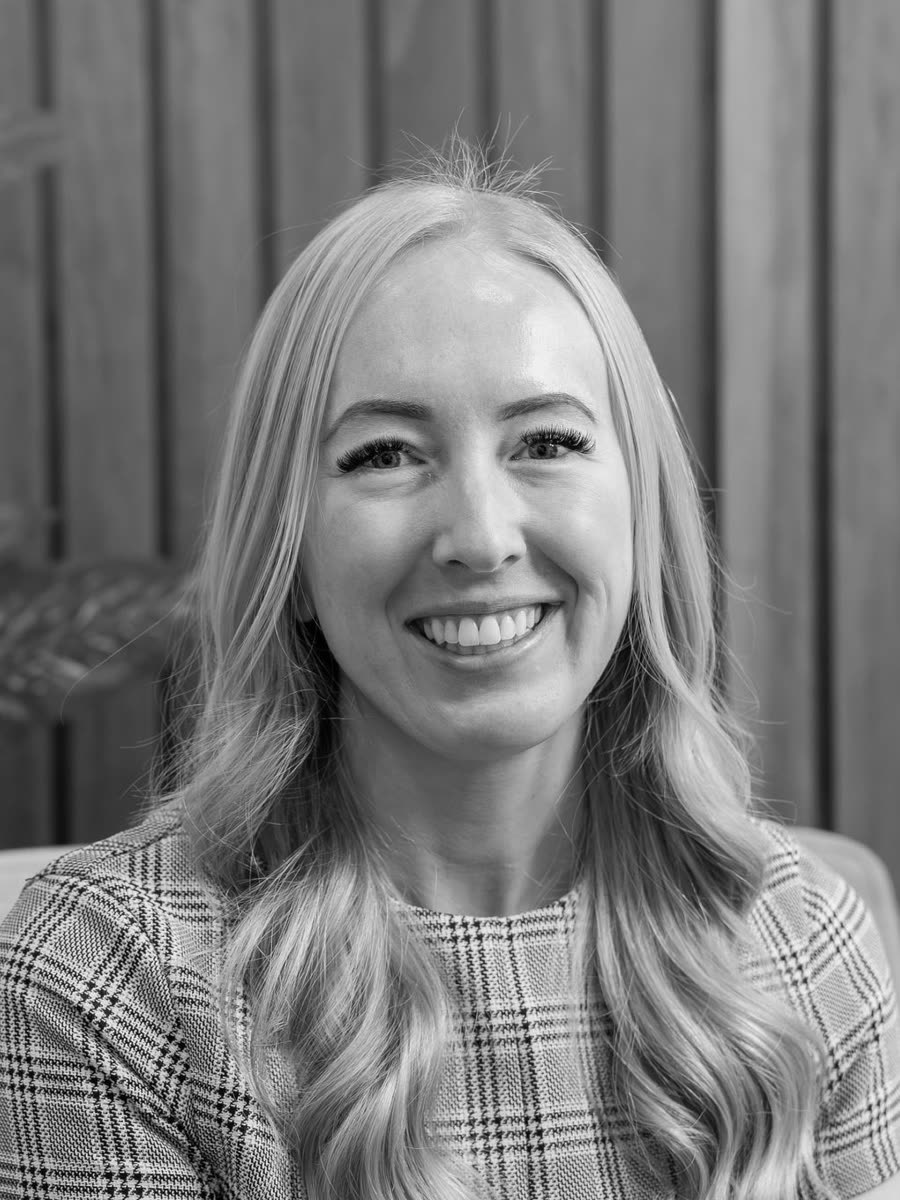 Tayllor Kluyt, regional manager, in black and white.